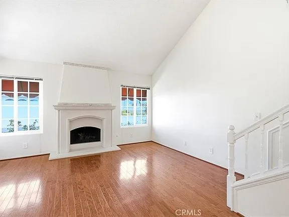 Upstairs room with fireplace and staircase at 28391 Borgona
